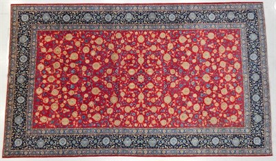 Lot 1239 - Large Isfahan Carpet Central Iran, circa 1970 The crimson field with an allover design of vines and