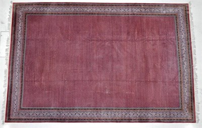 Lot 1246 - An Indian Carpet of Serabend Design, late 20th century The coral pink field with an all over...
