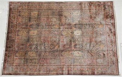 Lot 1247 - Kashmir Silk on Silk Carpet, circa 1960 The polychrome compartmentalised field of Persian...