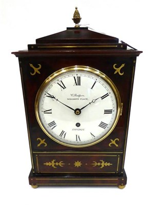 Lot 1255 - A Regency Style Brass Inlaid Mantel Timepiece, caddied pediment, ringed side carrying handles,...