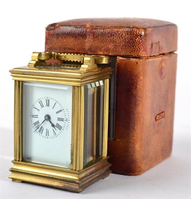 Lot 1276 - A Brass Miniature Carriage Timepiece, circa 1900, carrying handle, enamel dial with Roman numerals