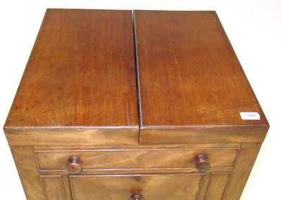Lot 1392 - A Mahogany Washstand, circa 1820-30, with two hinged leaves enclosing apertures for a wash...