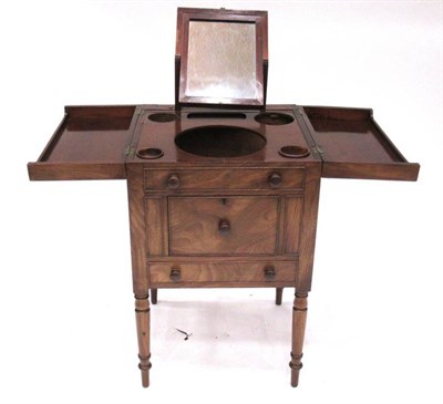 Lot 1392 - A Mahogany Washstand, circa 1820-30, with two hinged leaves enclosing apertures for a wash...