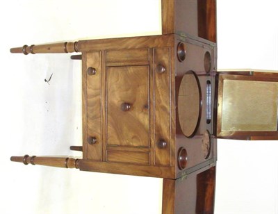 Lot 1392 - A Mahogany Washstand, circa 1820-30, with two hinged leaves enclosing apertures for a wash...