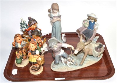 Lot 5 - A group of four Goebel Hummel figures; and three Lladro figures