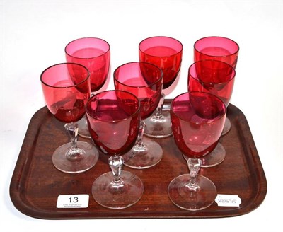 Lot 13 - A set of eight Victorian cranberry glass wines, each etched with a greyhound coat of arms