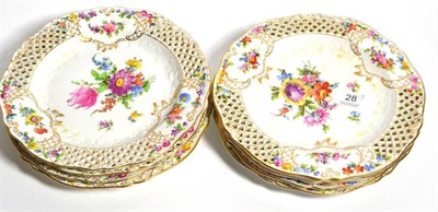 Lot 28 - Eight Dresden hand-painted floral plates with pierced rims