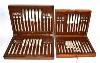 Lot 36 - An oak cased Mappin & Webb 'Princes Plate' set of twelve fish knives and forks, crested;...