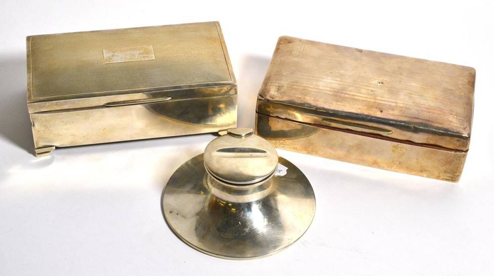 Lot 37 - An engine turned silver cigarette box; another silver cigarette box; and a silver capstan inkwell