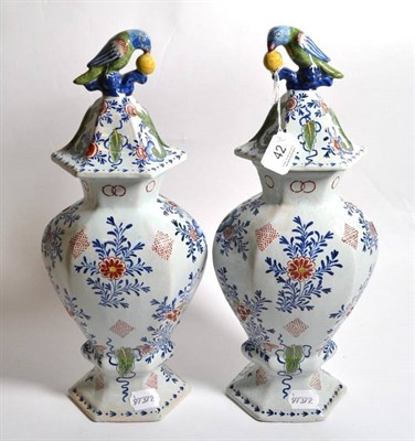 Lot 42 - A pair of Dutch Delft vases and covers