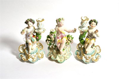 Lot 45 - A Derby porcelain figural chamberstick, circa 1775, modelled as a cherub sitting on a tree...