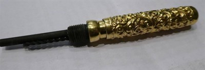 Lot 53 - A Mabie Todd ''Swan'' fountain pen, with repousse snail pattern decoration, in a fitted case