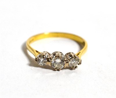 Lot 80 - An 18 carat gold diamond three stone ring, three graduated round brilliant cut diamonds, in...