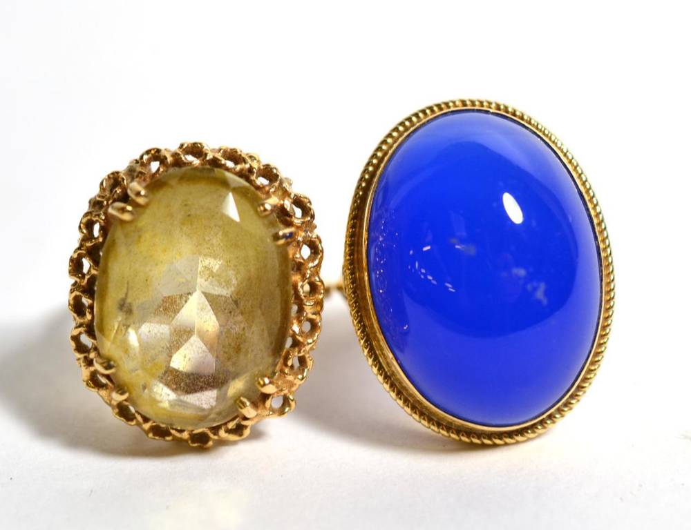 Lot 97 - A 9ct gold dress ring set with a blue Chalcedony cabouchon together with another 9ct gold dress...