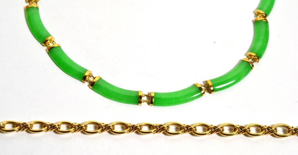 Lot 103 - A jade necklace with clasp stamped 14k and a necklace with clasp stamped 375