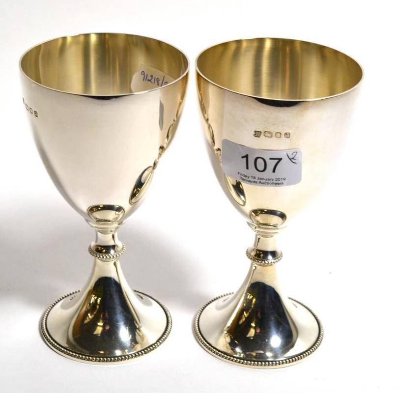 Lot 107 - A pair of silver goblets, Trevor Towner, London 1971, plain with bead borders, 14cm high,...