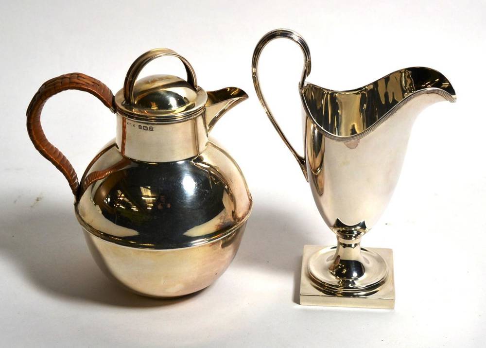 Lot 111 - A silver Jersey can hot water jug, Birmingham 1949, with raffia bound handle; and a modern...