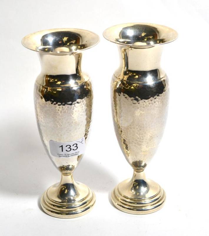 Lot 133 - A pair of silver vases, Deykin & Harrison, Birmingham 1929, with planished finish, 18.5cm high