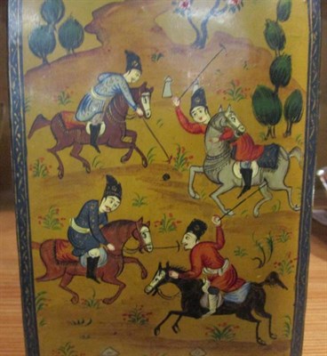 Lot 141 - A Persian papier mache box, decorated with polo payers, with a mirror to the interior