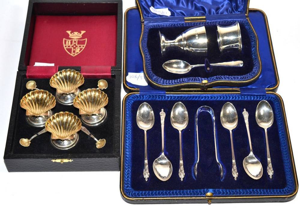 Lot 158 - A set of four silver pedestal shell salts and spoons, London 2002, in a fitted case; a silver...