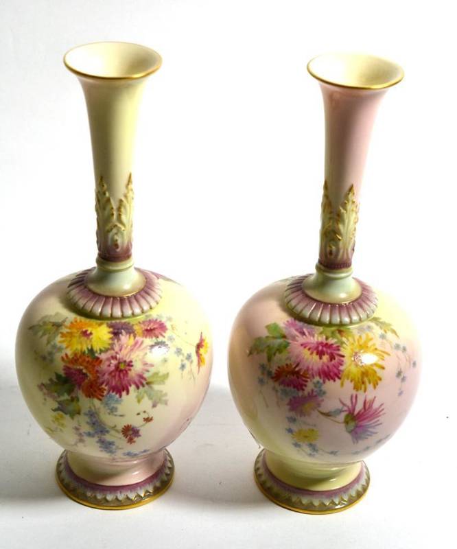 Lot 159 - A pair of Royal Worcester blush pink and ivory vases decorated with floral sprays, pattern...