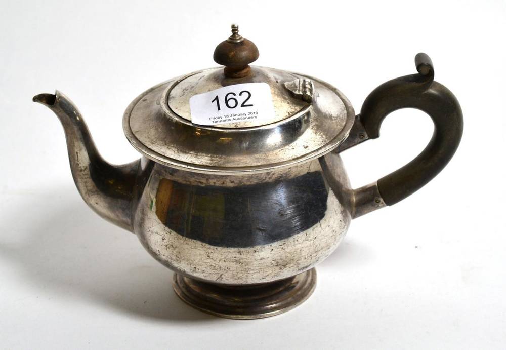 Lot 162 - A bachelors' silver pedestal teapot, William Hutton & Son, Birmingham 1938, 13cm high, 11.9ozt