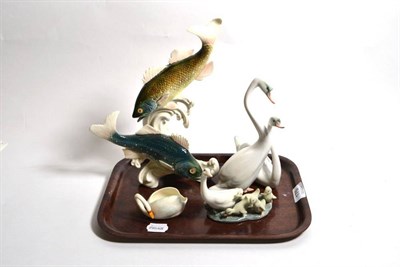 Lot 175 - A Karl Ens model of two fish amongst waves, a Herend porcelain model of two swans, A Lladro...