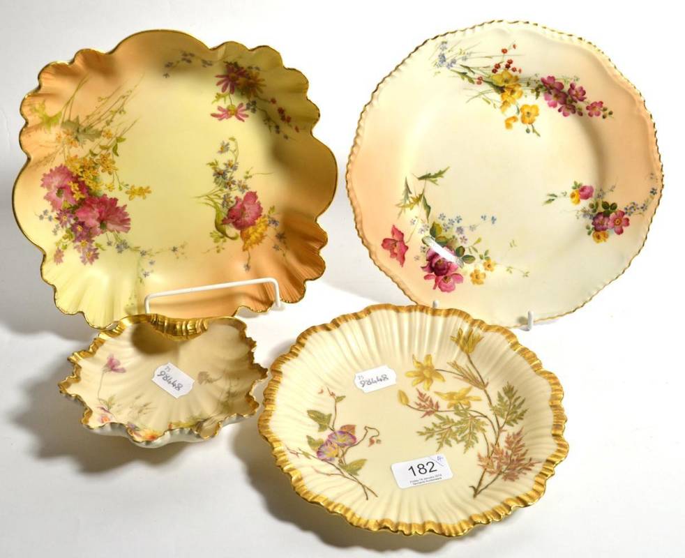 Lot 182 - A group of Royal Worcester blush ivory comprising three plates decorated with foliate and...