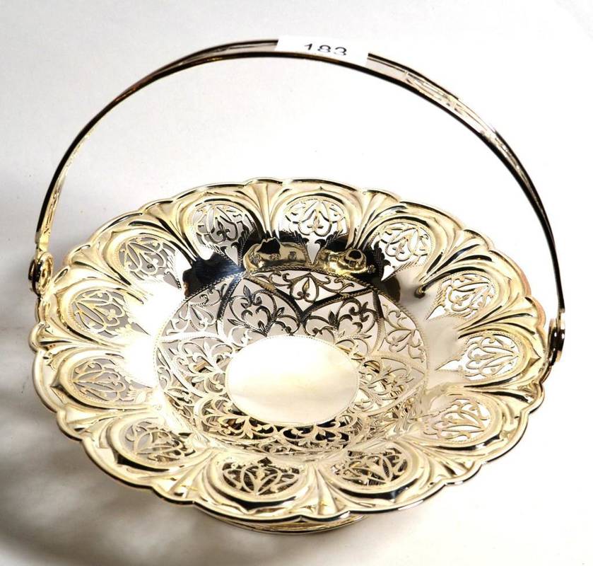 Lot 183 - A pierced silver swing handled cake basket, C J Vander, Sheffield 2000, 24cm diameter, 17.7ozt