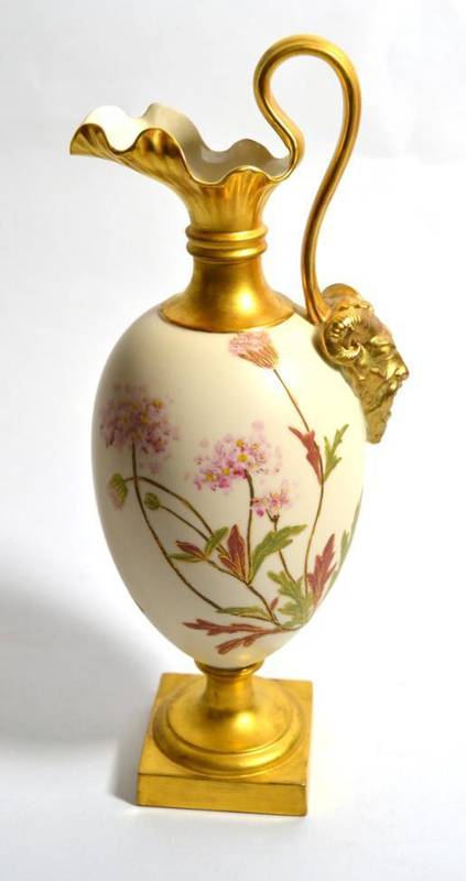 Lot 191 - A Royal Worcester blush ivory ewer the base of the handle decorated with a satyr mask and decorated