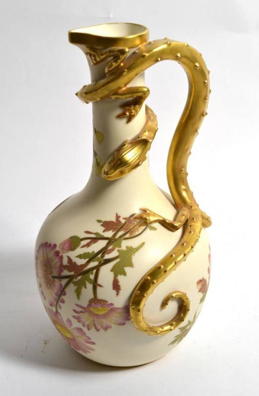 Lot 193 - A Royal Worcester blush ivory ewer with applied gilt lizard handle decorated with floral sprays