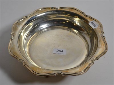 Lot 204 - A silver bowl, by Atkin Bros. Sheffield, 1944, shaped rim, raised on four supports, approx. 22ozs