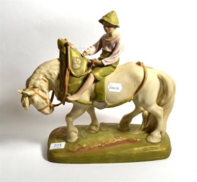 Lot 224 - A post 1918 Royal Dux figure of a boy astride a Shire horse