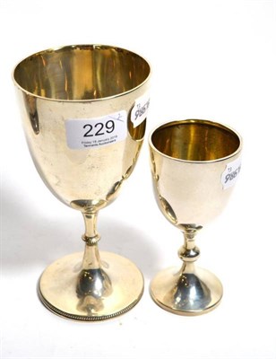 Lot 229 - A silver wine cup, London 1867; together with a smaller example, Birmingham 1925 (2)