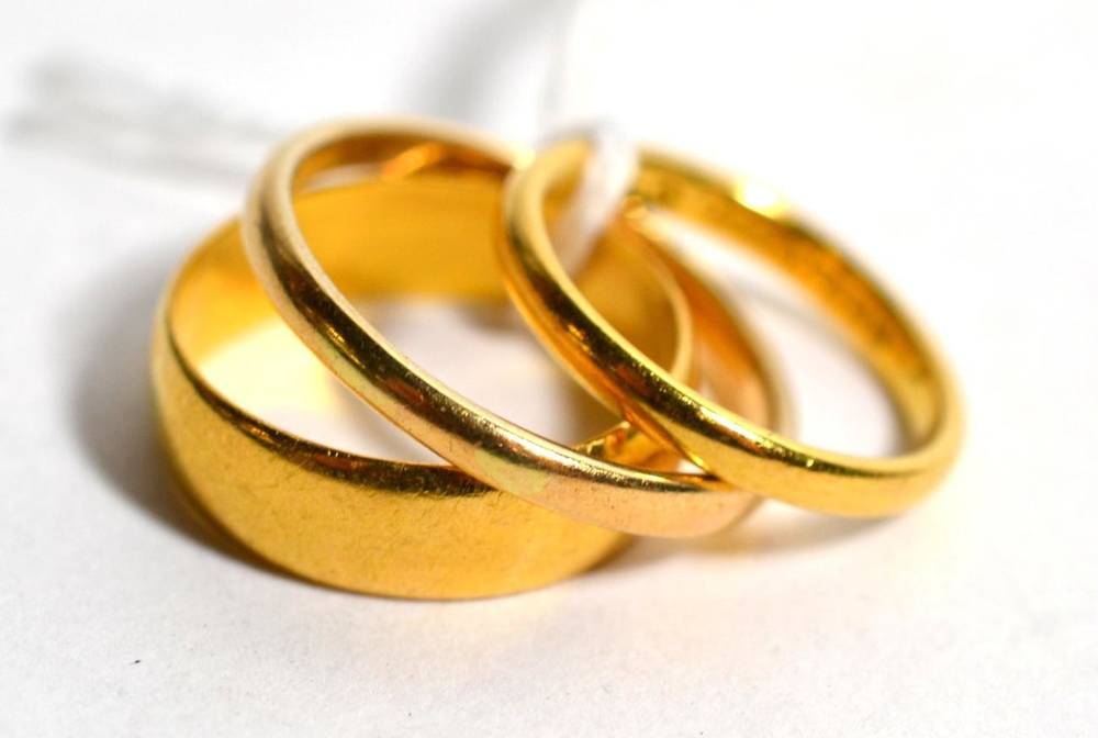Lot 240 - Three 22ct gold band rings