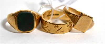 Lot 245 - Two 9 carat signet rings and a wedding band (3)