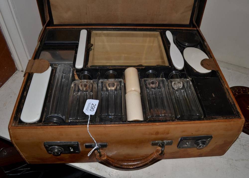 Lot 290 - A French leather travelling case with ivory and silver mounted fittings, early 20th century