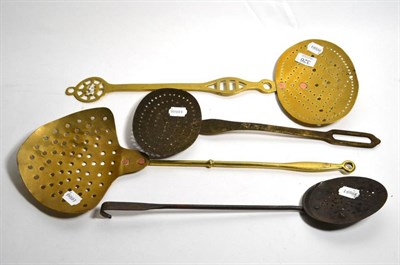 Lot 326 - Four various 19th century brass and iron cream skimmers