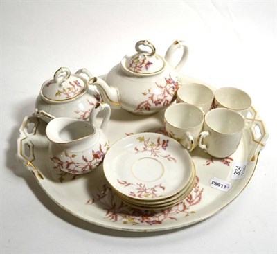 Lot 334 - A Limoges floral painted porcelain cabaret set