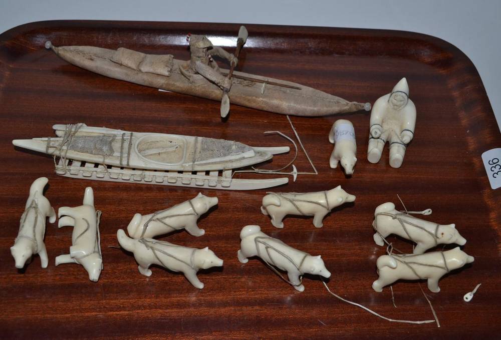 Lot 336 - Inuit artifacts comprising marine ivory dog sled and kayak