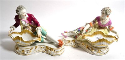 Lot 359 - A pair of Meissen style figural sweetmeat dishes, late 19th/early 20th century, in the 18th century