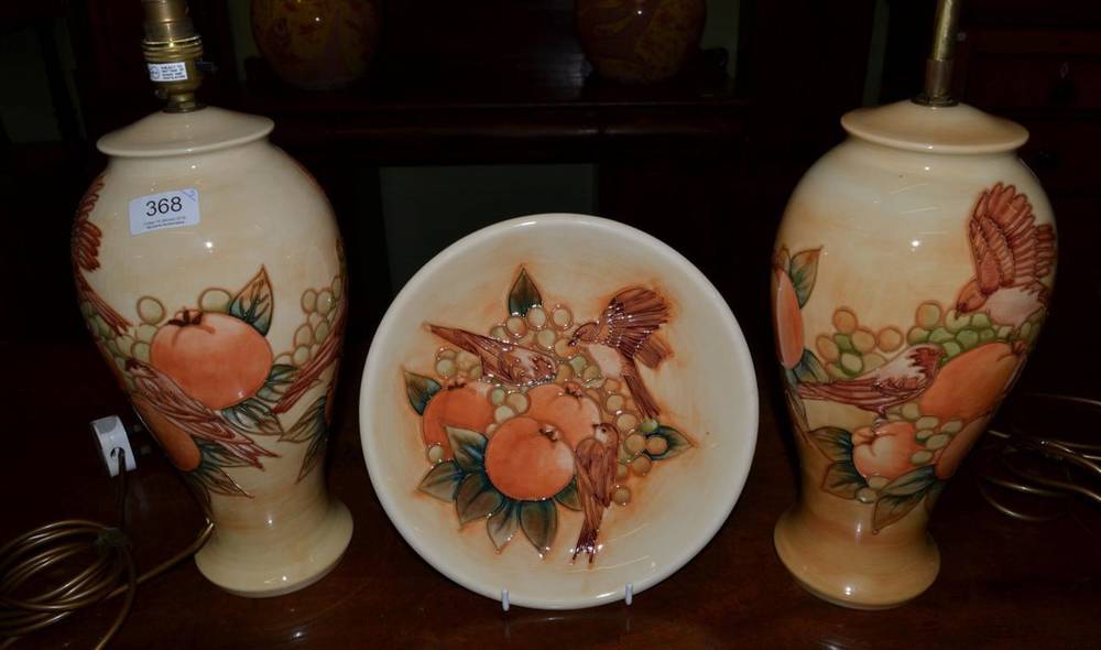 Lot 368 - A pair of modern Moorcroft Golden Finch lamps and a matching plate (3)