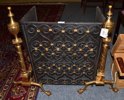 Lot 1130 - A pair of brass andirons of classical design together with a spark guard