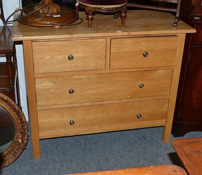 Lot 1141 - A modern light oak three height chest of drawers