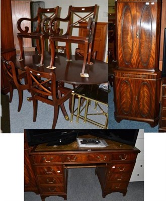 Lot 1143 - A mahogany reproduction pedestal desk; a standing corner cabinet with keys; and a mahogany...