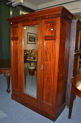 Lot 1151 - A mahogany mirror fronted wardrobe