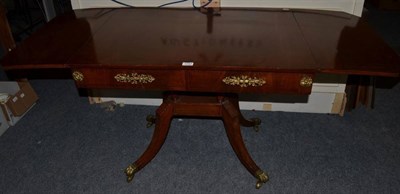 Lot 1152 - A Regency style mahogany and ebony strung sofa table, with gilt metal mounts
