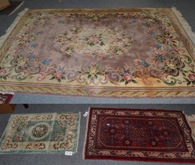 Lot 1157 - A small Chinese carpet; a Chinese silk rug and two other rugs (4)