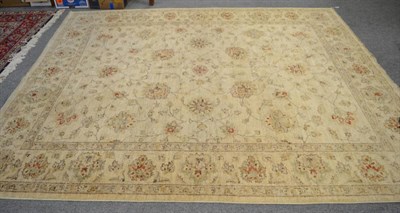 Lot 1158 - An Afghan 'Ziegler' Carpet of unusual size, the cream field of scrolling vines enclosed by...