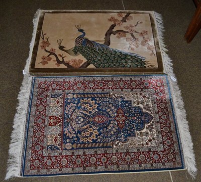 Lot 1161 - Hereke design silk Prayer rug, the indigo field beneath the Mihrab enclosed by floral borders, 92cm